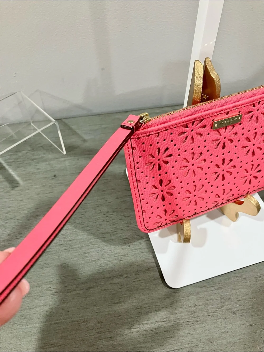 Kate Spade laser-cut floral wristlet clutch in pink